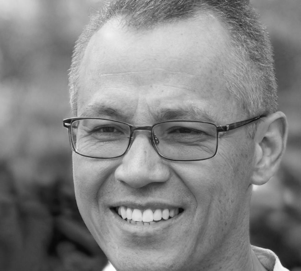 Senior financial analyst reviewing market data